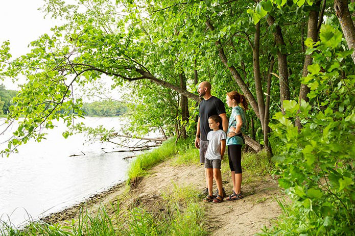 Family walking by the river