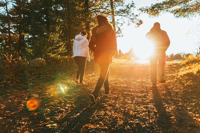 Friends walking by the river